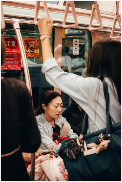 A candid view of commuters on a busy Tokyo train s