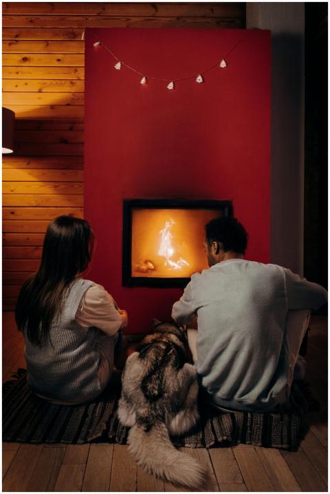 A couple and their dog enjoying a warm evening by