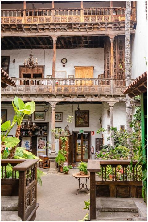 Charming courtyard with rustic wood details and lu