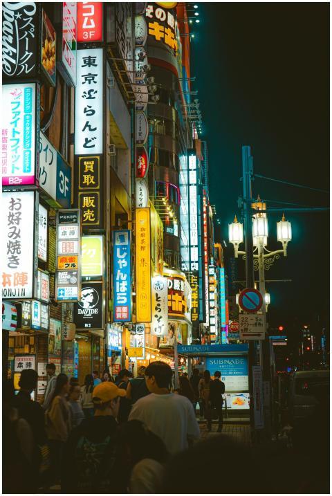 Bustling night scene of Shinjuku, Tokyo with neon