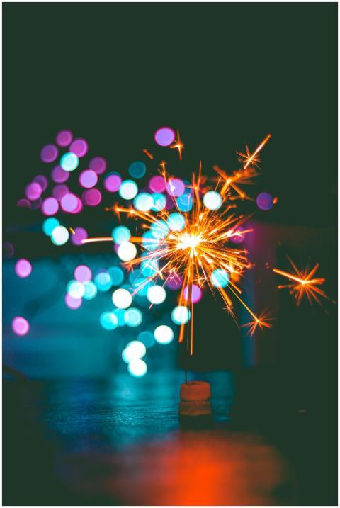 A dynamic sparkler igniting against a colorful bok