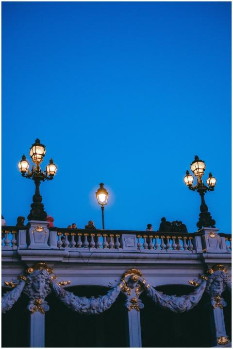 Illuminated vintage street lamps on a grand bridge