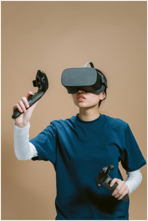 Young woman wearing VR headset and using controlle