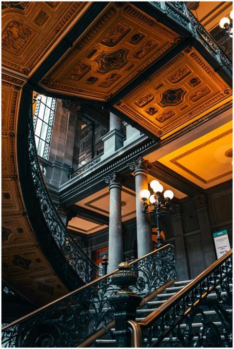 Ornate staircase and detailed ceiling in a histori