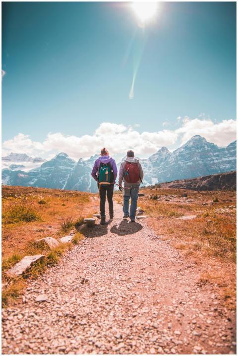 Two hikers walking on a scenic trail in Banff Nati