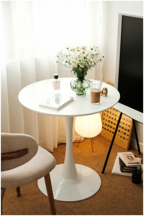 A serene and elegantly arranged table setup with d