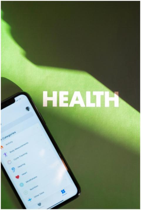 Smartphone displaying health app under light and s