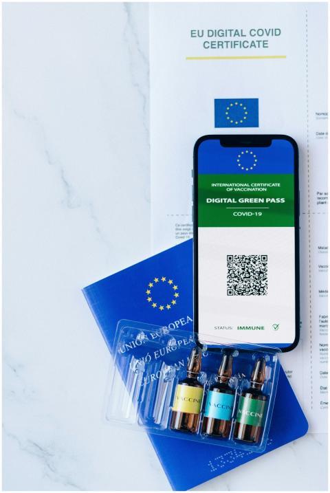 Smartphone displaying EU Digital Green Pass alongs