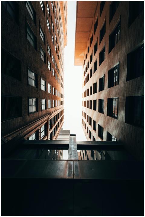 A unique low angle view of modern skyscrapers in d