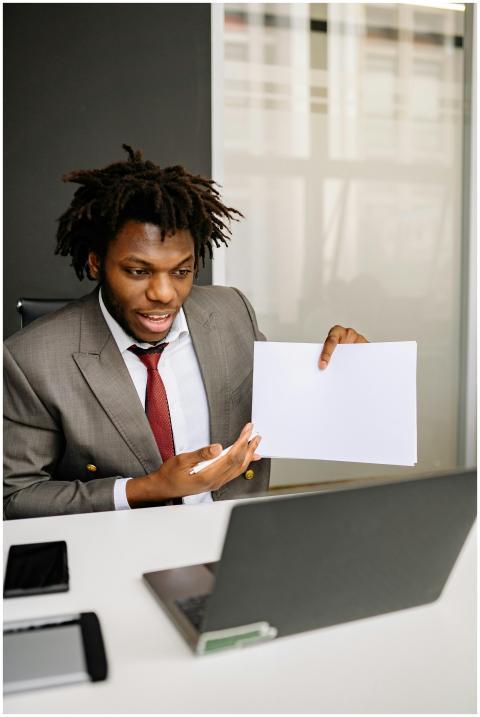 Professional man in suit discussing during an onli