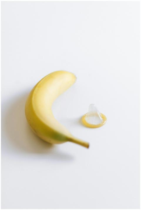A banana beside a condom symbolizing safe sex and