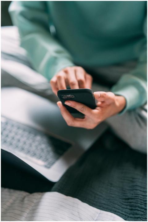 Crop anonymous male freelancer text messaging on m