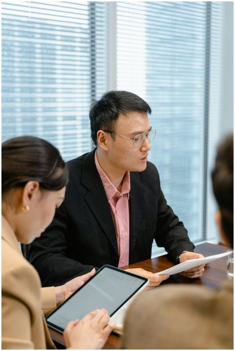 Professional team in a modern office discussing bu