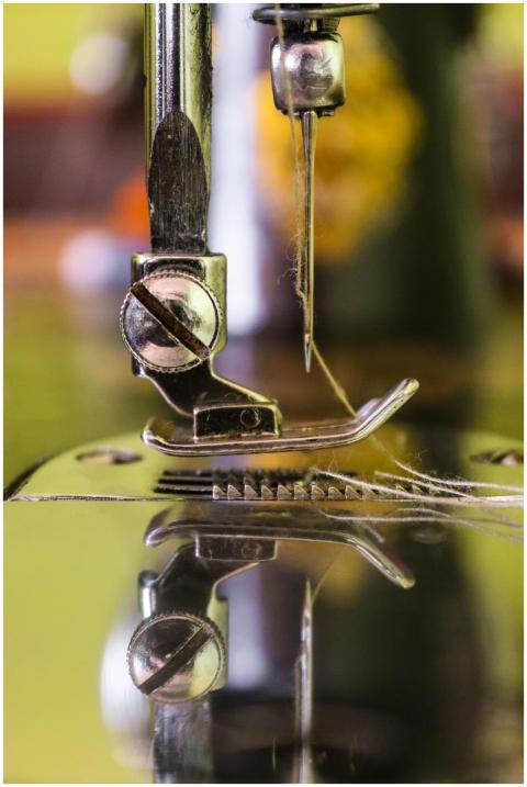 Detailed view of a sewing machine needle threading