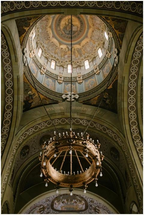 From below of chandelier and ornamental domed ceil