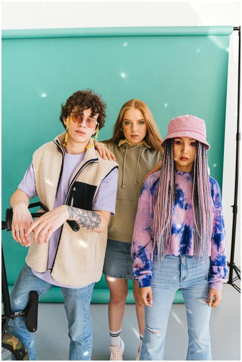 Vibrant group of trendy young models in a studio p