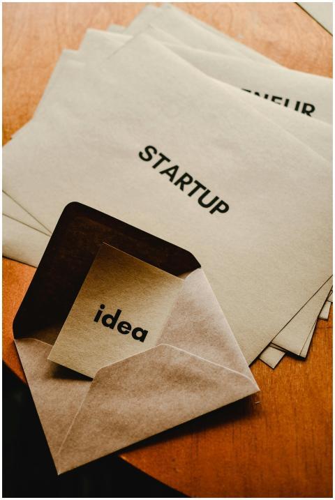 A flat lay of envelopes with startup text, ideal f