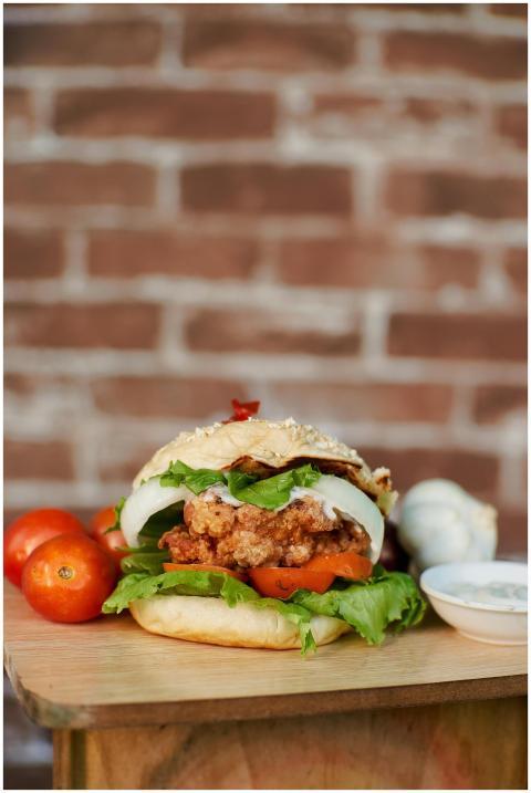 Mouth-watering fried chicken burger with fresh let