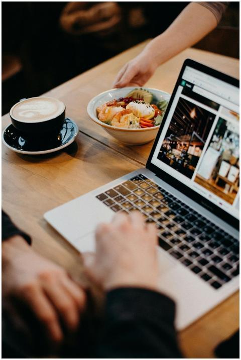 A contemporary workspace with a laptop, coffee, an