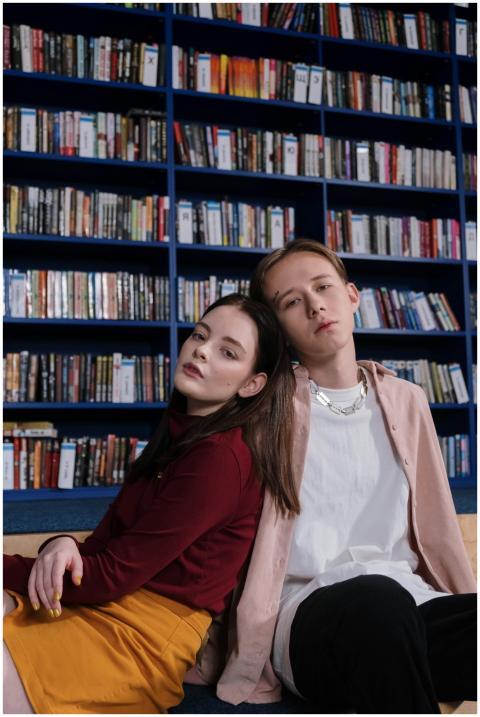 Teenagers sitting together in a library, symbolizi