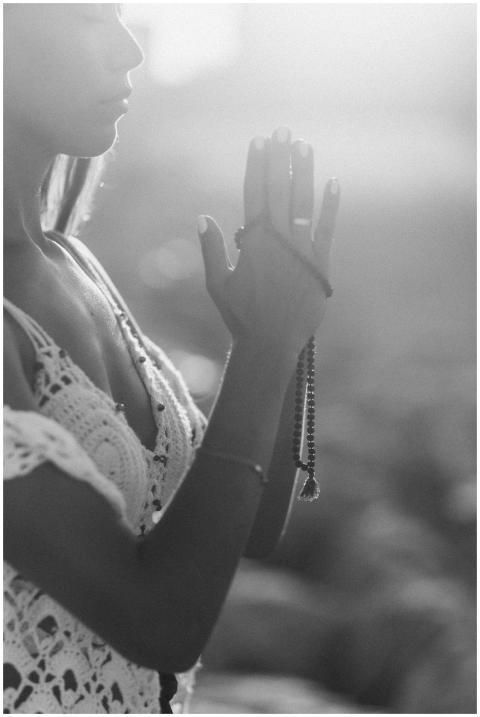 Woman practicing meditation outdoors in calm dayli