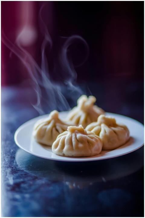 Delicious and steaming hot dumplings served on a c