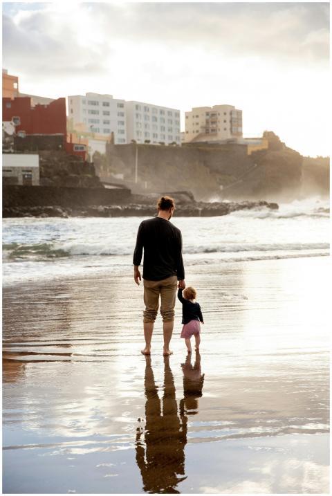 A touching family moment of a father and child wal