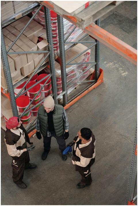High-angle view of a team discussing logistics in