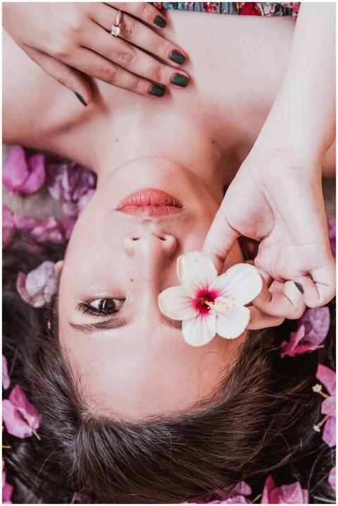 Elegant photoshoot featuring a woman holding a pin