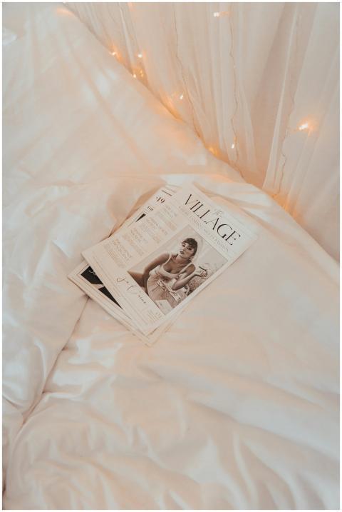 Warm and cozy bedroom scene featuring a magazine o