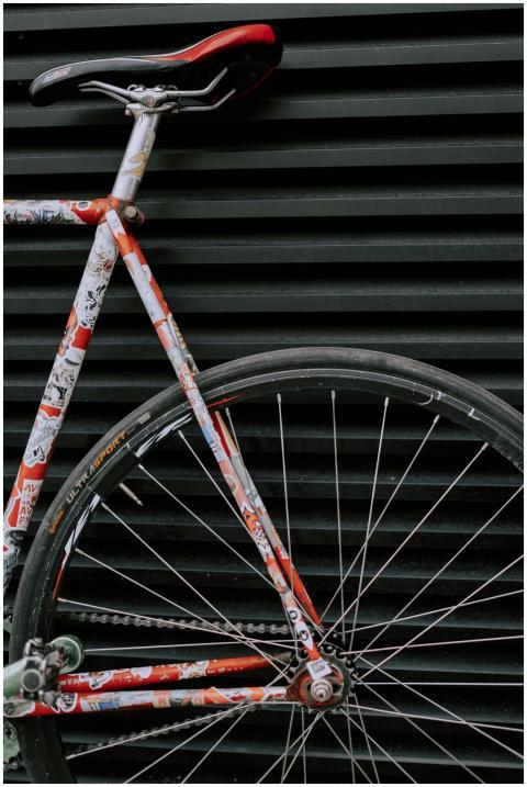 Detailed close-up of a colorful bicycle against a