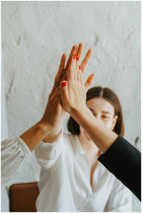 A group of adults in a warm atmosphere celebrating