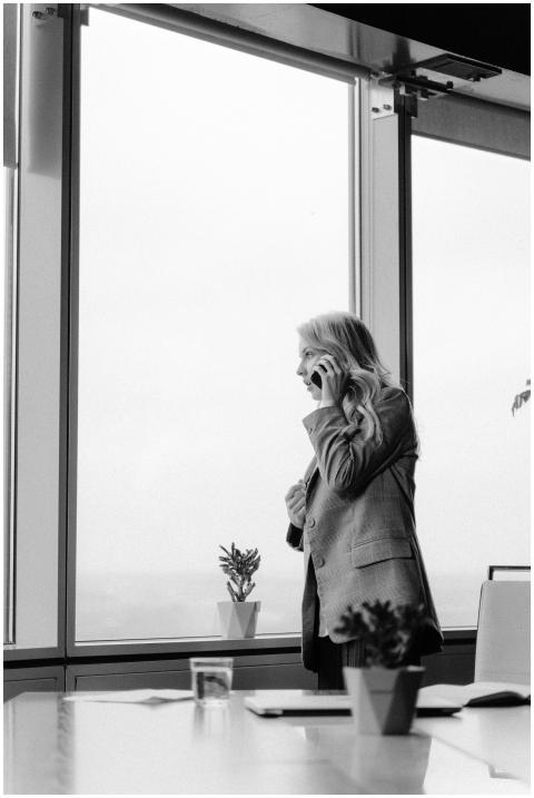 Black and white image of a woman in a business set