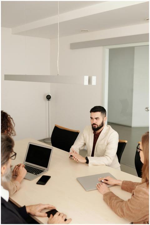 A diverse group engaged in a business meeting in a