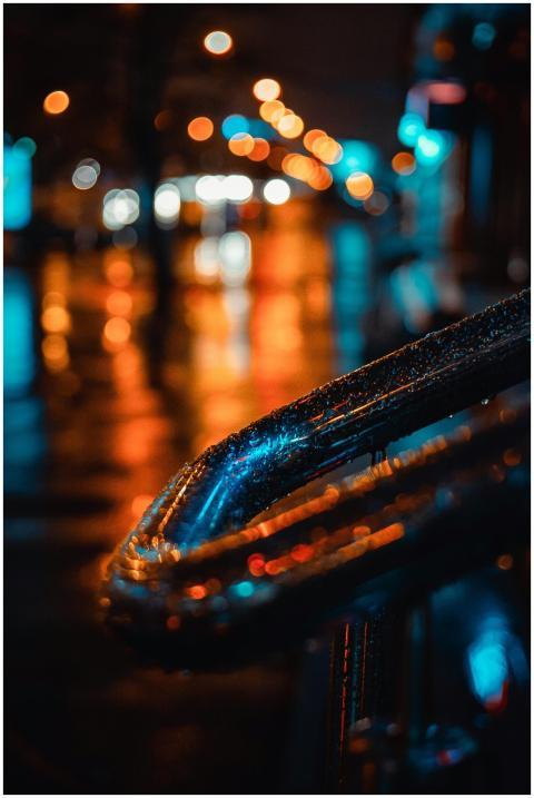 Moody night street scene with blurred lights and a