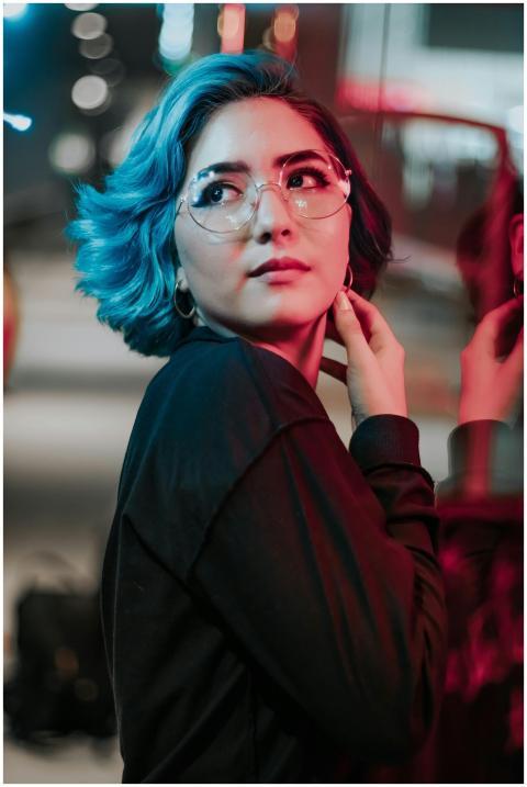 Vibrant portrait of an Asian woman with blue hair