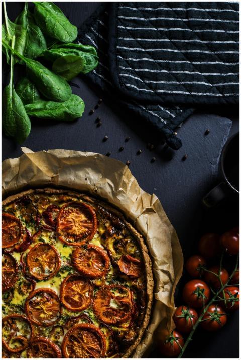 A delicious homemade tomato quiche with fresh spin