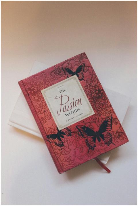 Red journal with floral and butterfly cover design