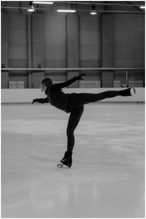 Black and white photo of a woman ice skating grace
