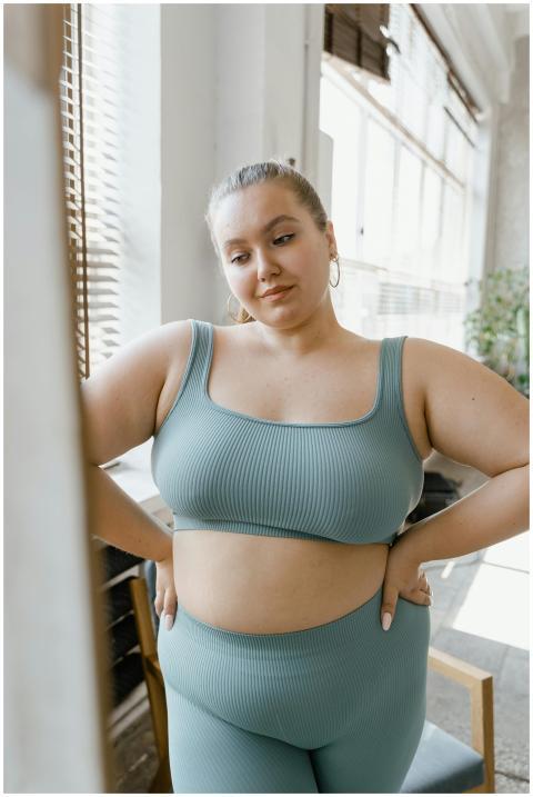 Plus size woman embracing body positivity in styli