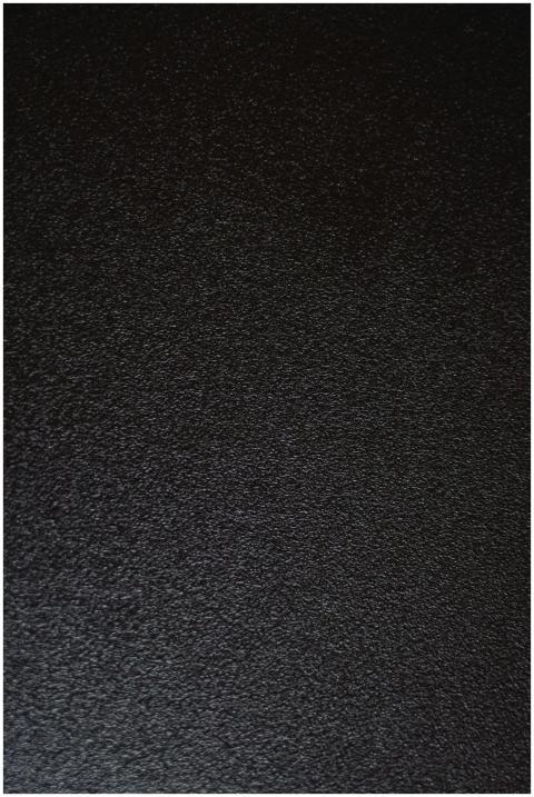 A detailed and textured black surface ideal for ba