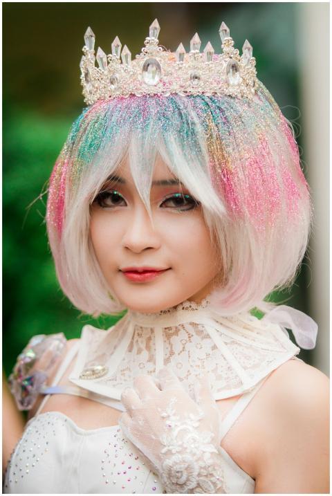 Colorful portrait of a woman in cosplay with glitt