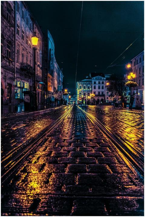 Moody cobblestone street in Lviv, Ukraine, illumin