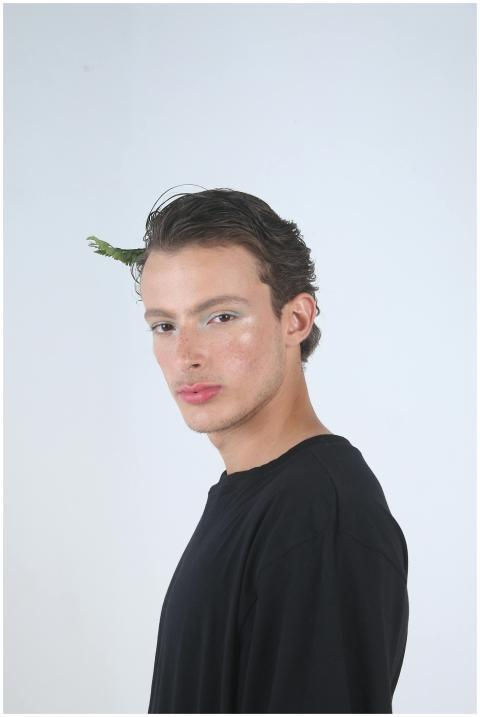 Modern portrait capturing a stylish young man with