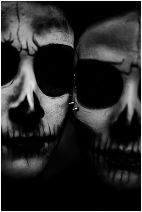 Close-up portrait of two faces with skull makeup i