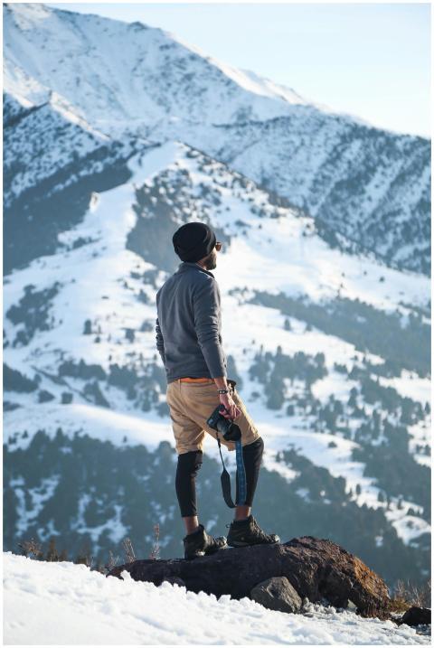 Adventurer explores snowy terrain in Ak-Talaa Dist