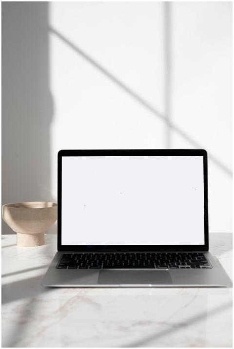 A sleek laptop displayed on a marble surface with