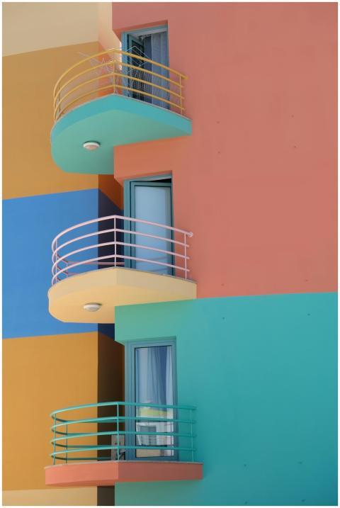 Bright colorful building with modern balconies in