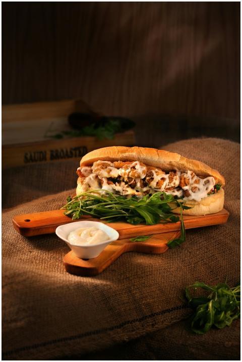 Delicious chicken sandwich with mayonnaise and gre