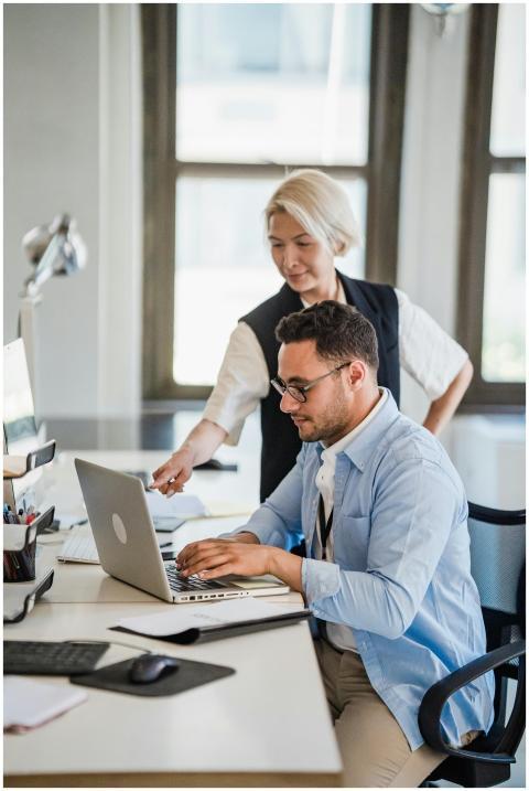 A man and woman collaborating on a project in a mo